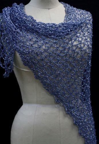 Blue shawl draped to show how it falls over the shoulders.