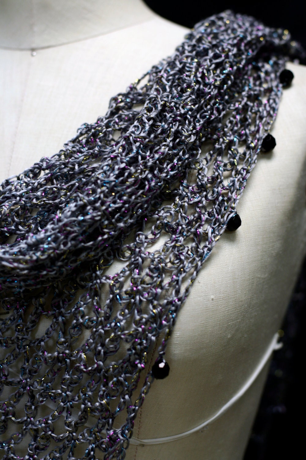Gray shawl draped to show how it falls over the shoulders.