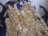 Gold Shawl — Champagne gold shawl draped to show how it falls over the shoulders.