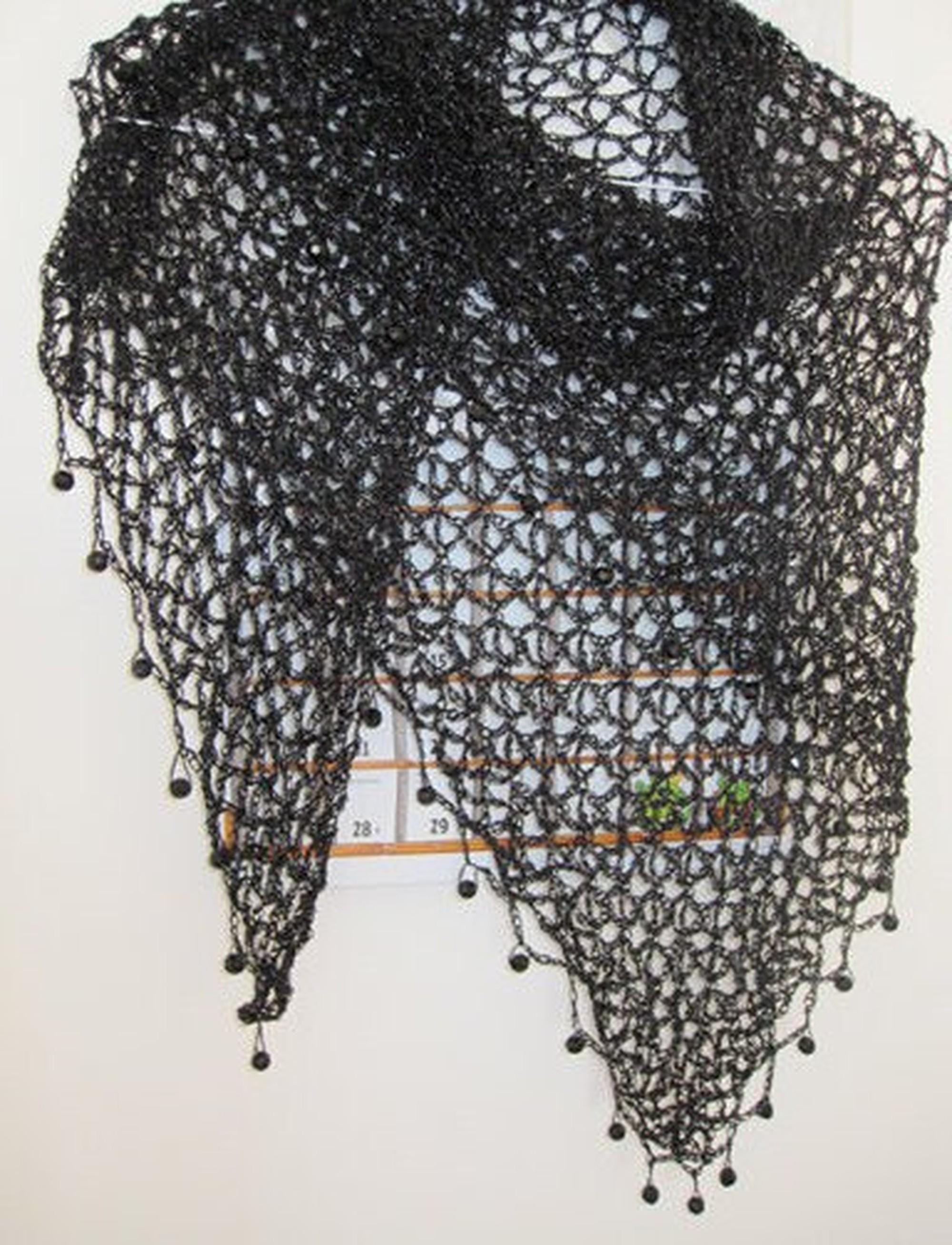 Black shawl, full view of the hand-crocheted piece.