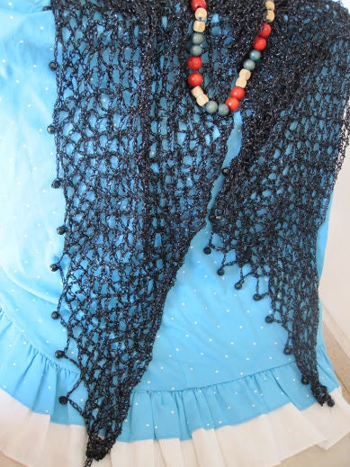 Black shawl draped to show how it falls over the shoulders.