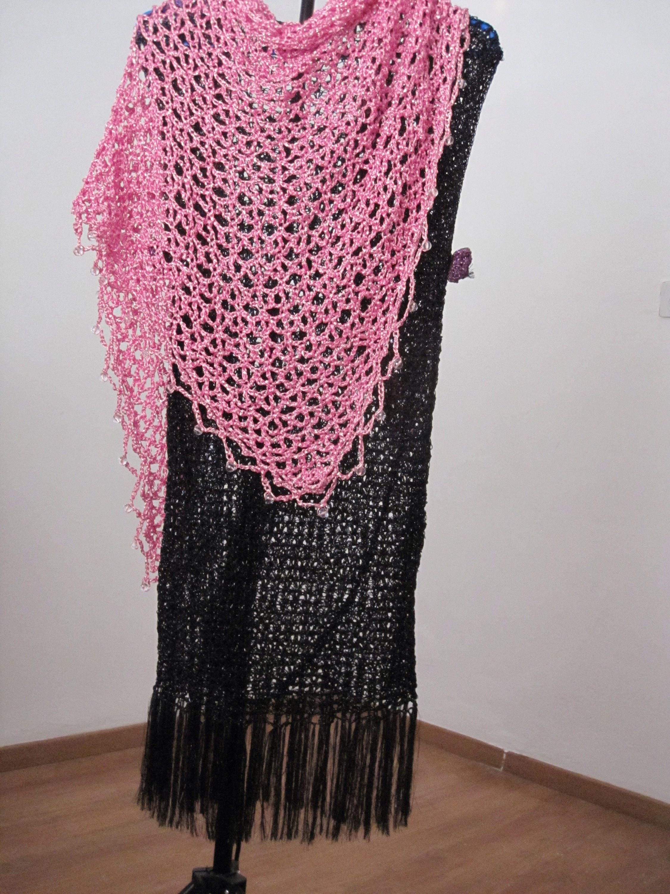 Detail of the hand stitches along the beaded edge of the blush pink shawl.