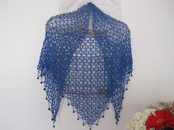 Blue shawl draped to show how it falls over the shoulders.