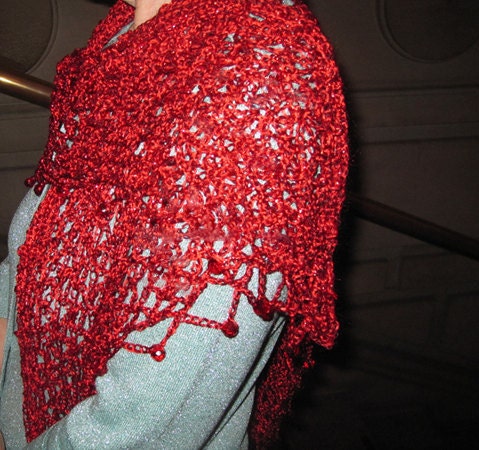 Red shawl draped to show how it falls over the shoulders.