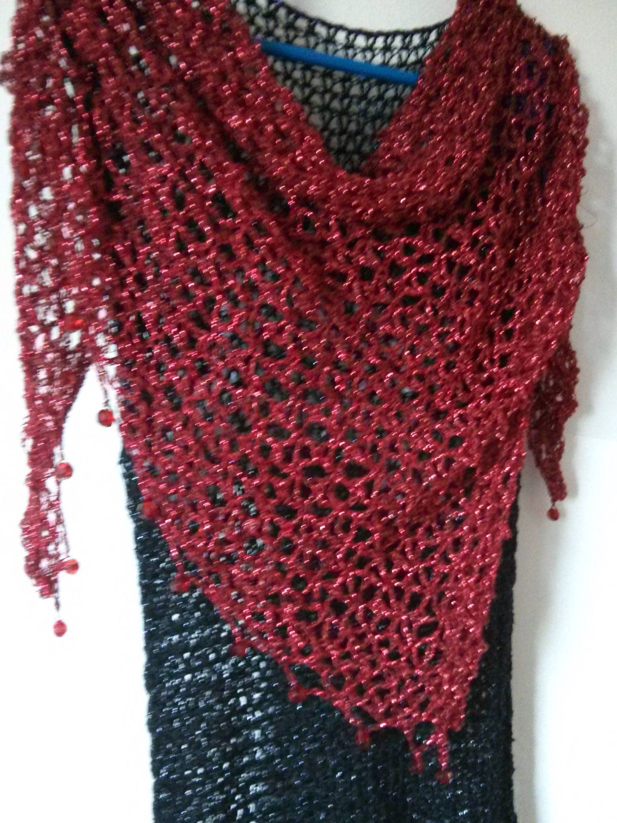 Red shawl draped to show how it falls over the shoulders.