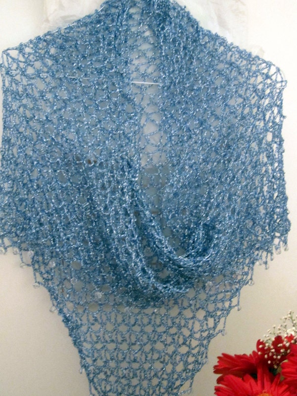 Sky blue shawl draped to show how it falls over the shoulders.