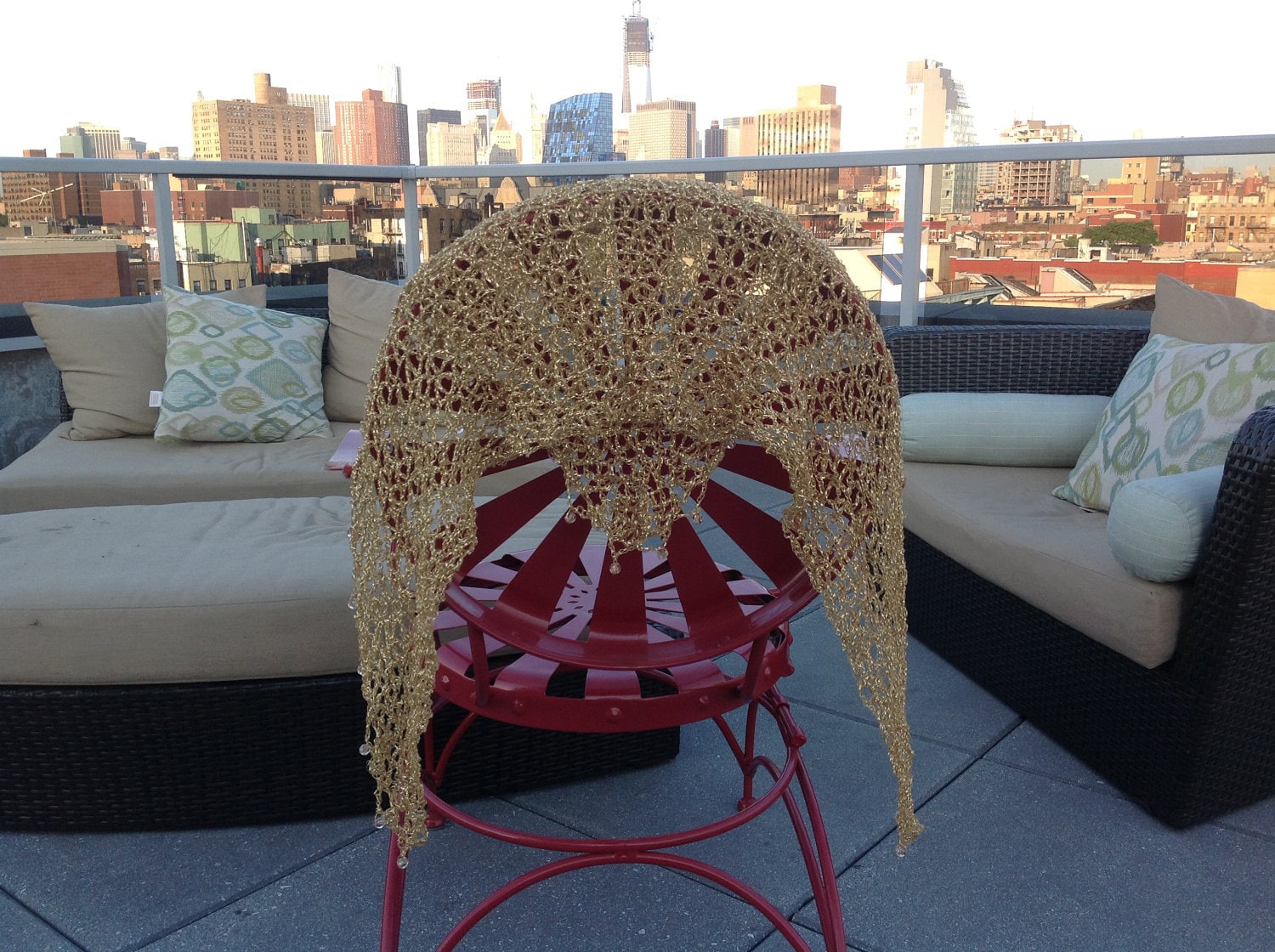 Close-up of the gold crochet openwork and beaded edge of the shawl.