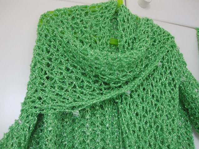Green shawl, full view of the hand-crocheted piece.