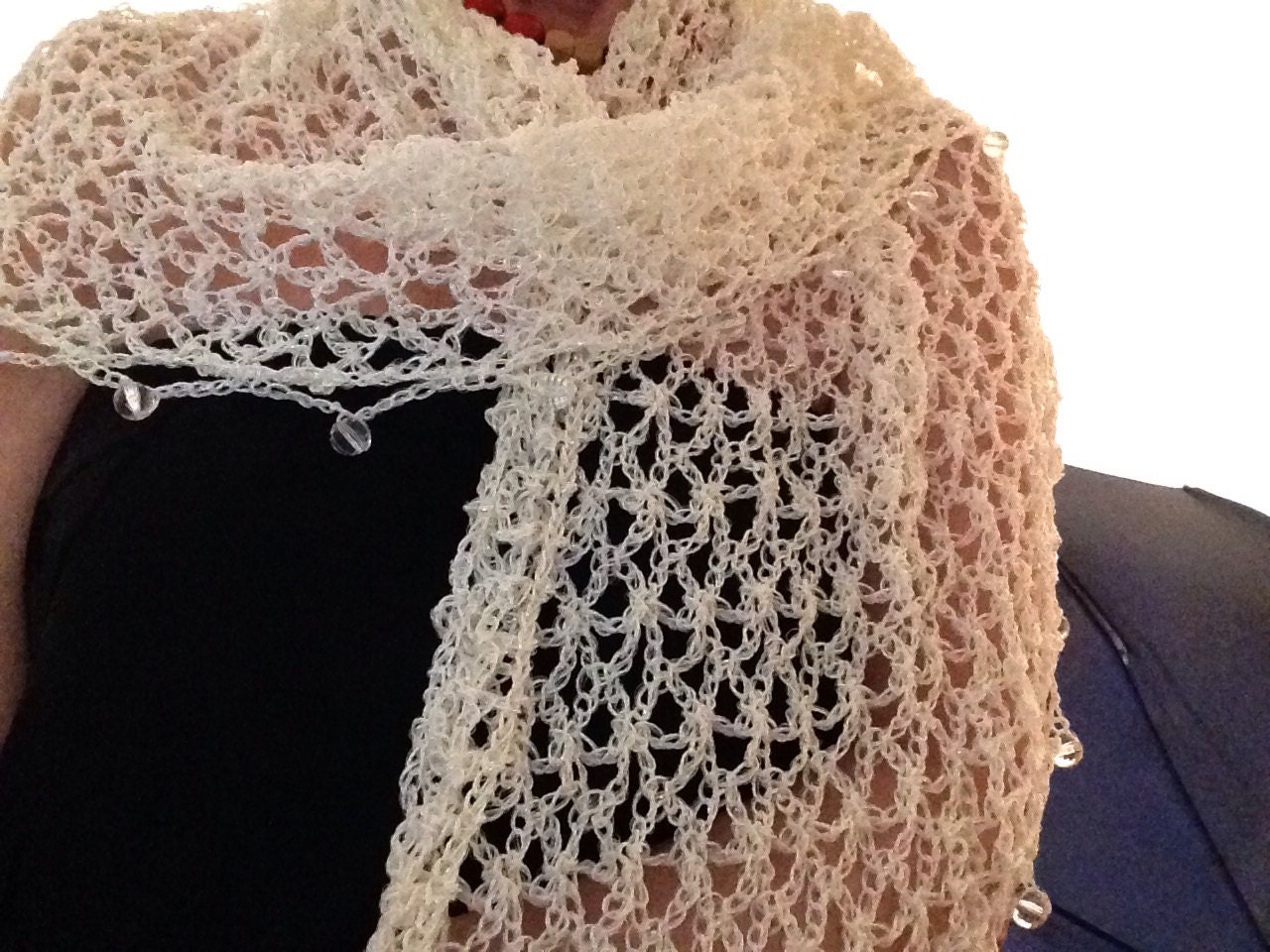 White shawl, full view of the hand-crocheted piece.