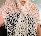 Wedding Shawl — Close-up of the white crochet openwork and beaded edge of the shawl.