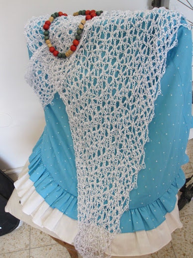 White shawl draped to show how it falls over the shoulders.