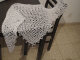 Wedding Shawl — Side view of the white shawl, the shimmering thread catching the light.