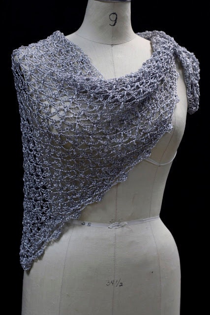 Close-up of the silver crochet openwork and beaded edge of the shawl.