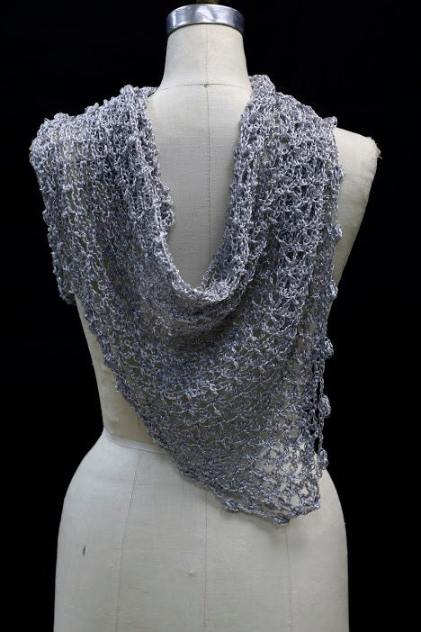 Silver shawl draped to show how it falls over the shoulders.