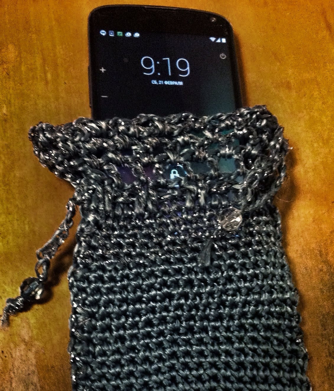 Gray phone pouch, full view of the hand-crocheted piece.