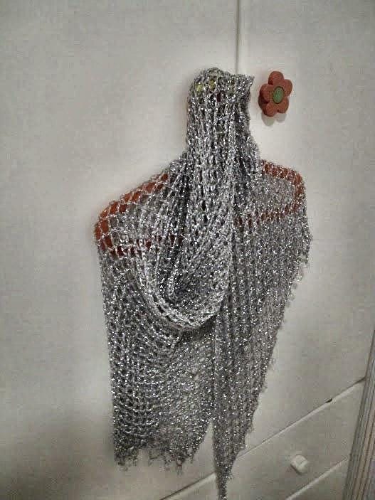 Close-up of the silver crochet openwork and beaded edge of the shawl.