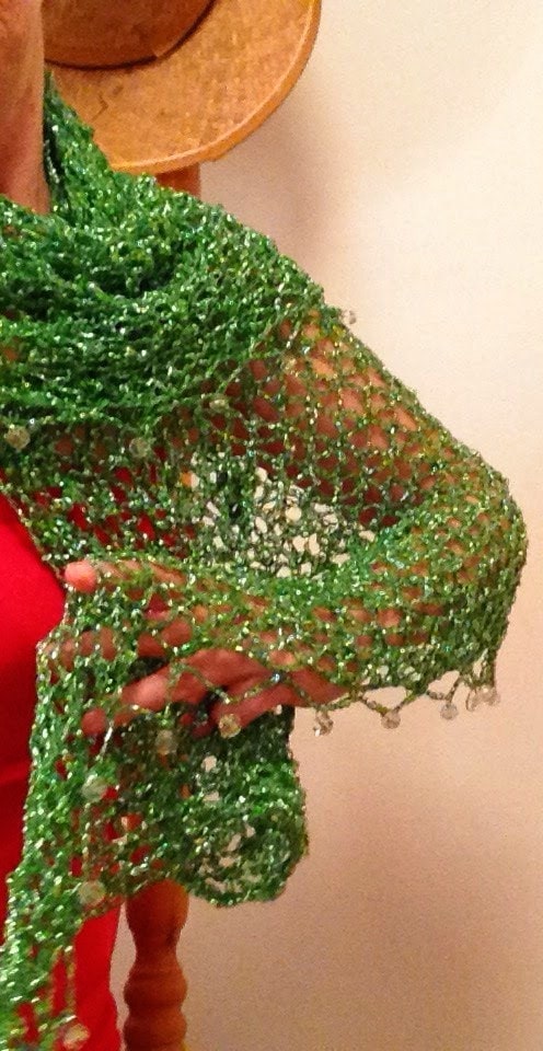 Emerald green shawl draped to show how it falls over the shoulders.