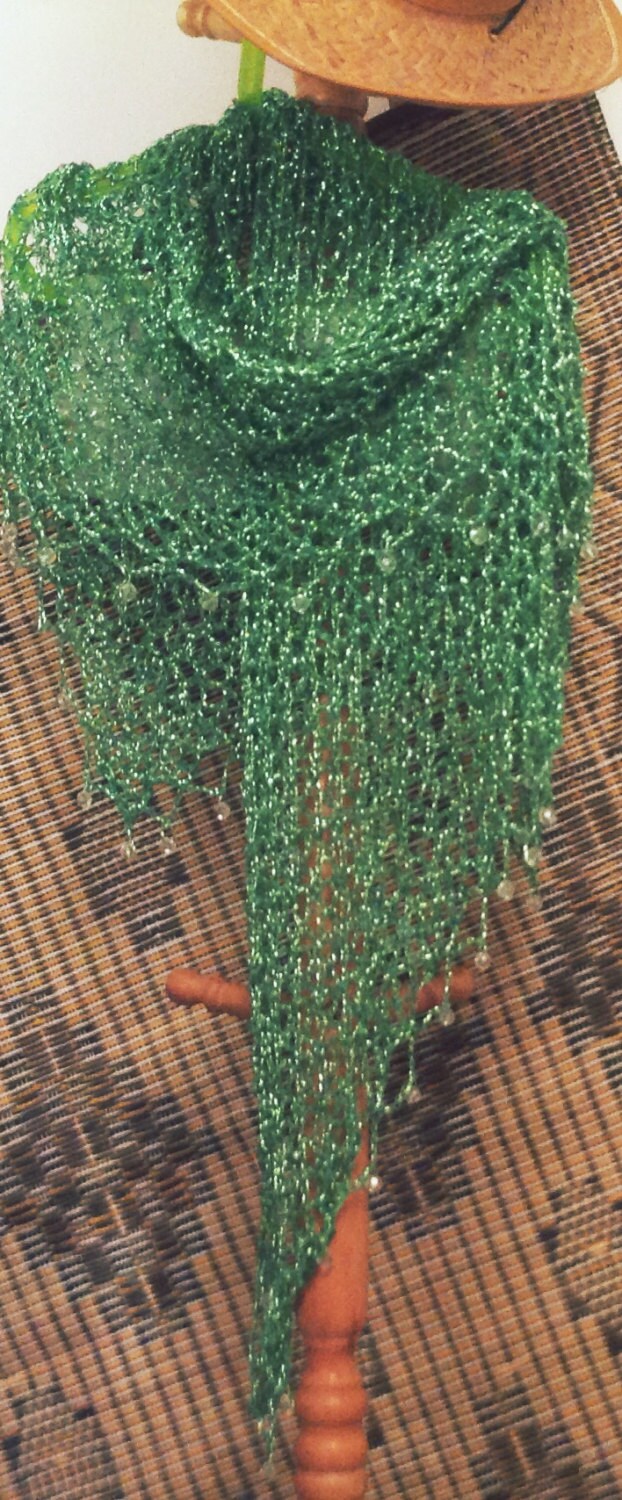 Side view of the emerald green shawl, the shimmering thread catching the light.