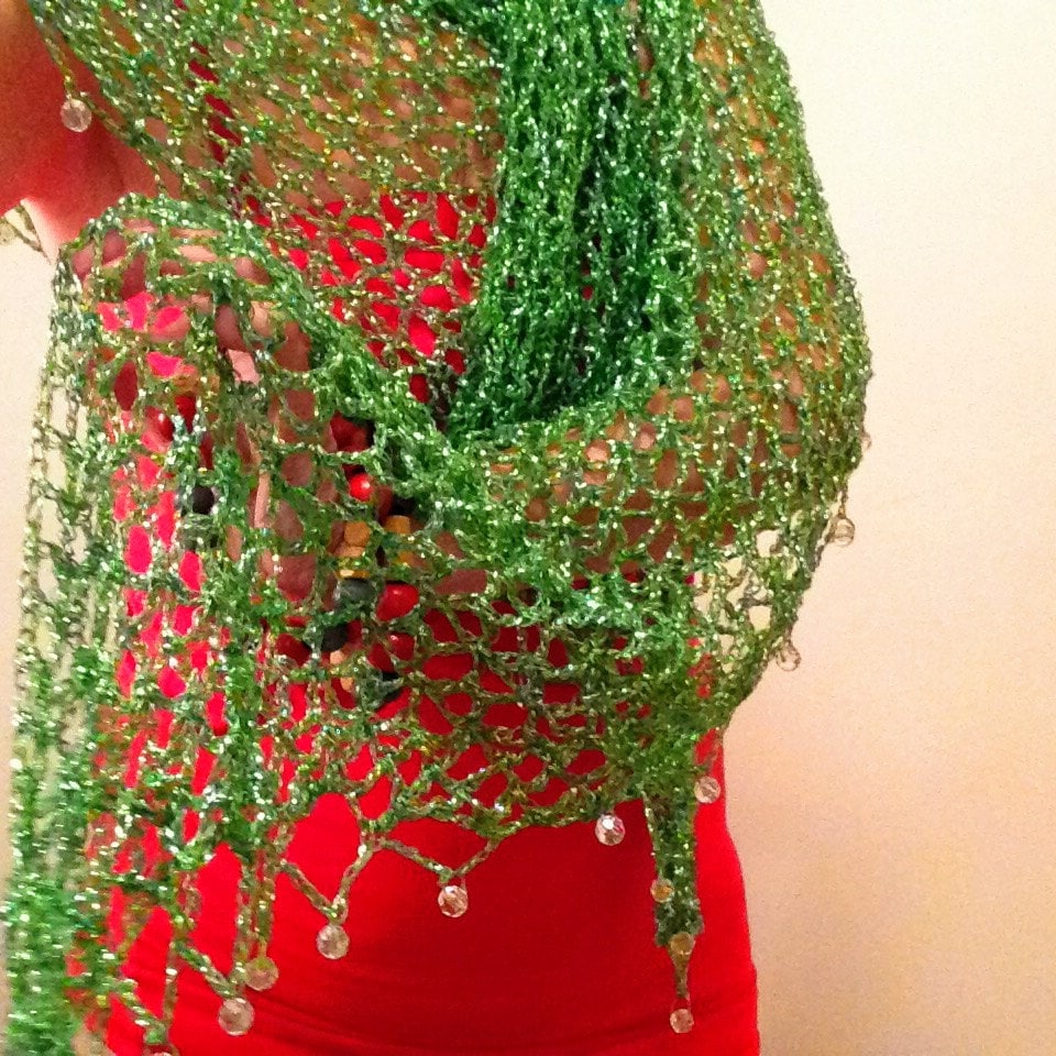 Detail of the hand stitches along the beaded edge of the emerald green shawl.