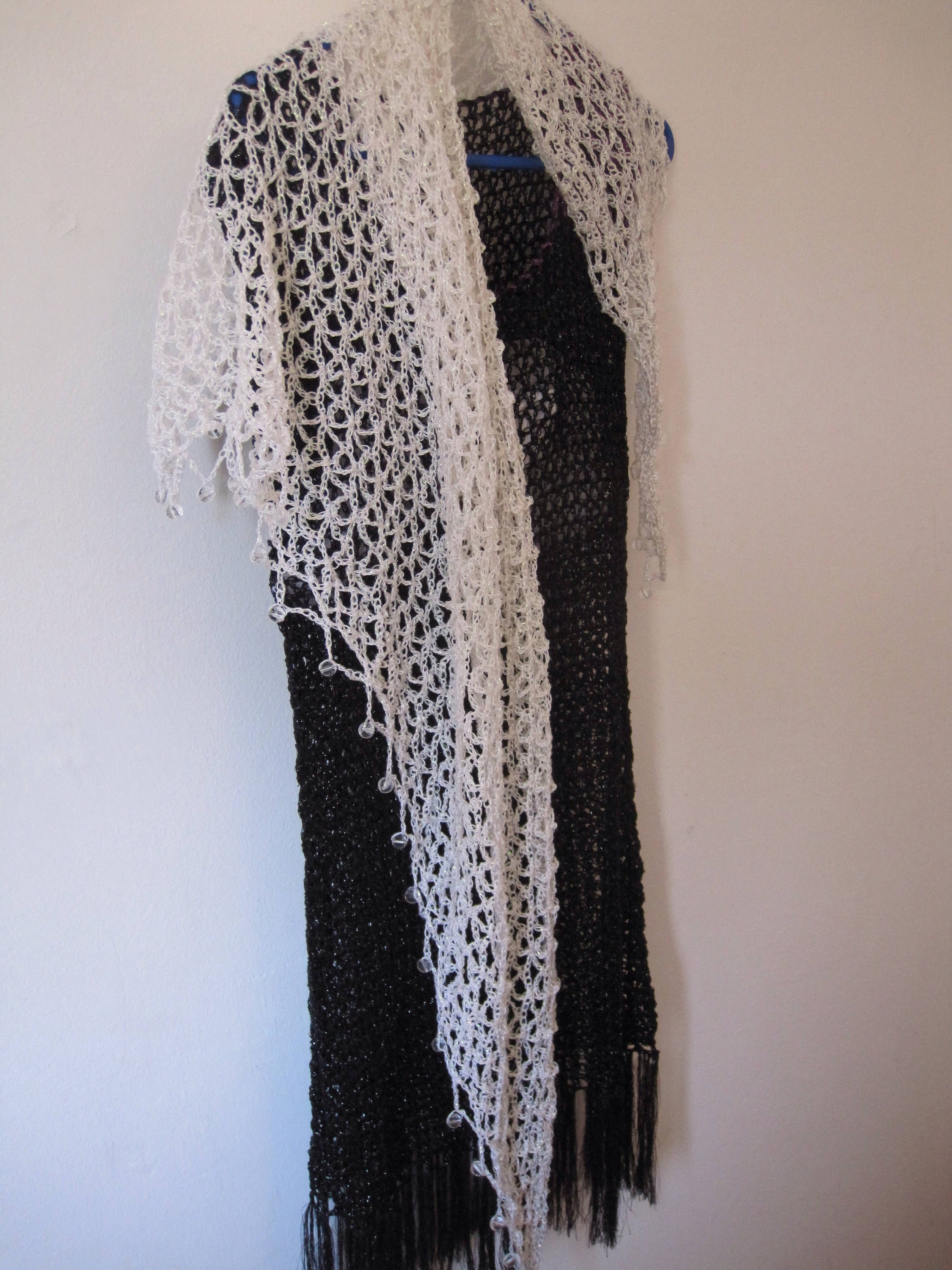 Cream shawl draped to show how it falls over the shoulders.