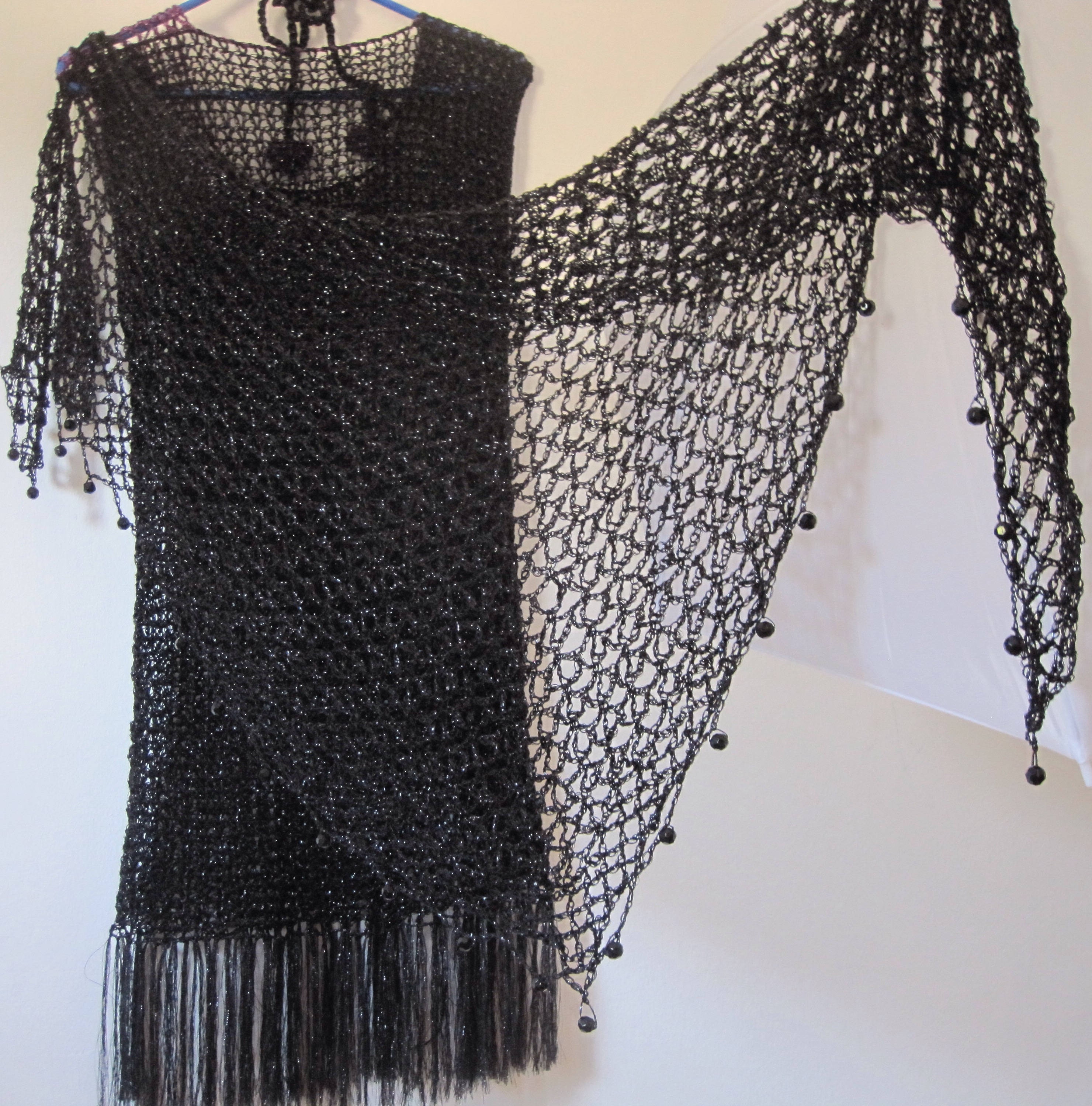 Black shawl, full view of the hand-crocheted piece.