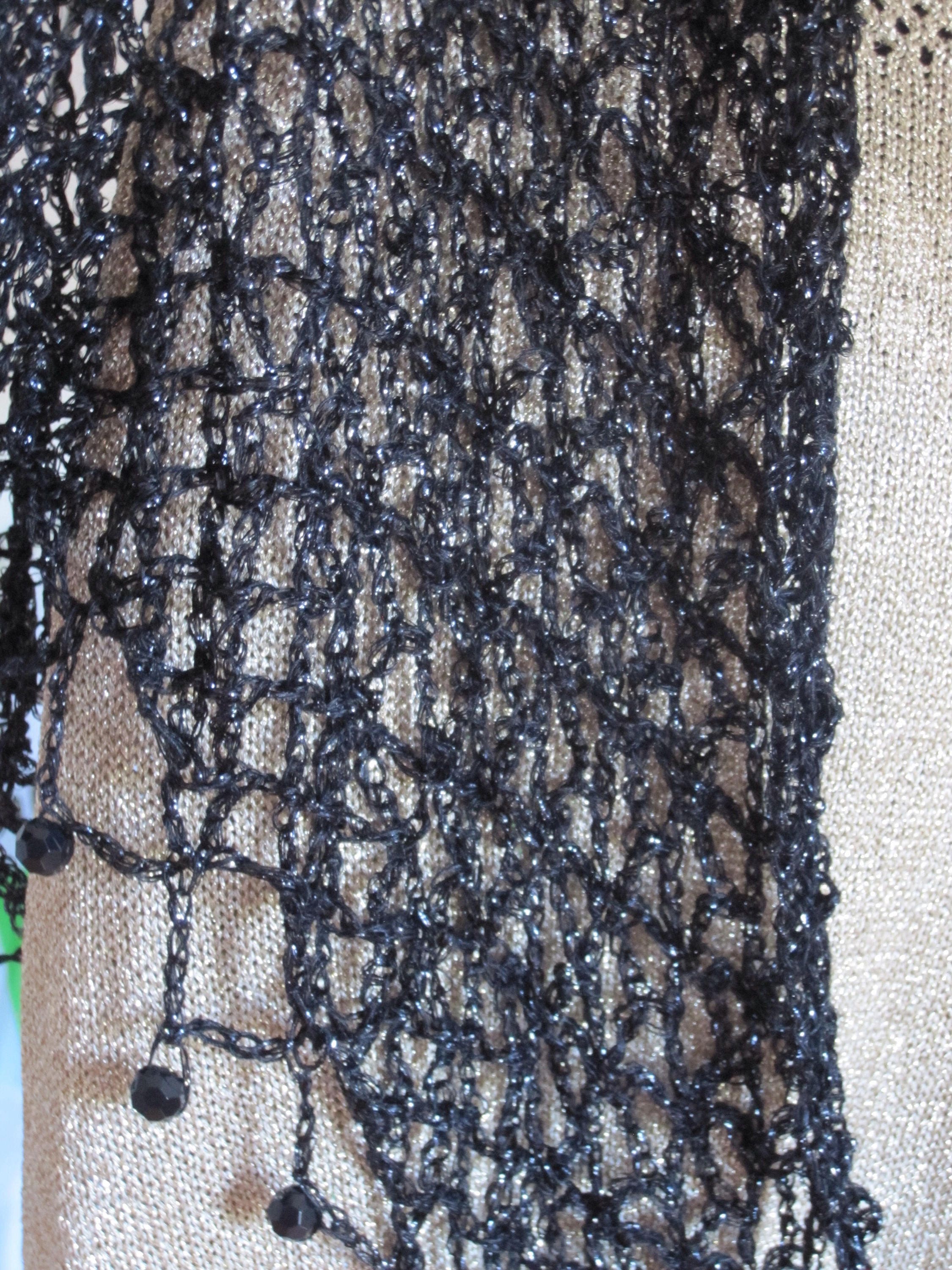 Black shawl draped to show how it falls over the shoulders.