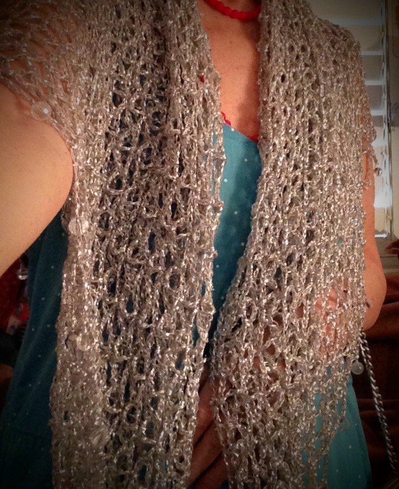 Side view of the silver shawl, the shimmering thread catching the light.