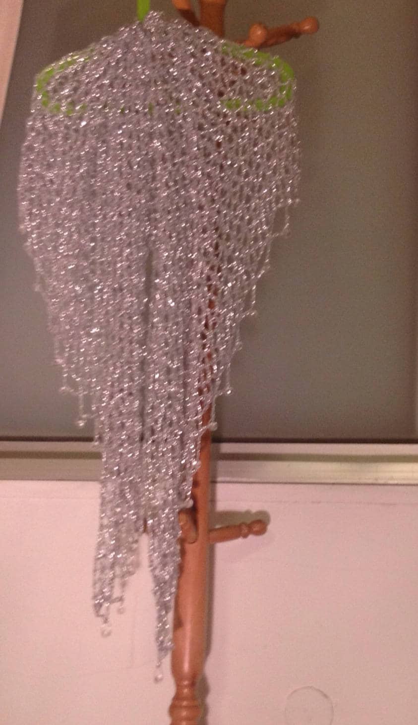 Silver shawl, full view of the hand-crocheted piece.