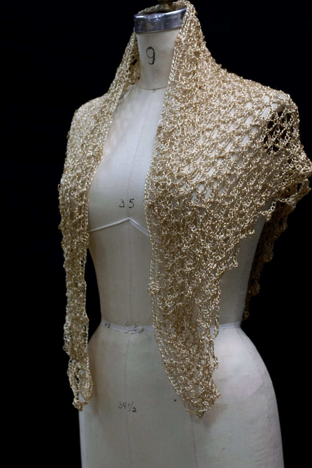 Gold shawl, full view of the hand-crocheted piece.