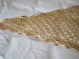 Gold Shawl — Detail of the hand stitches along the beaded edge of the gold shawl.
